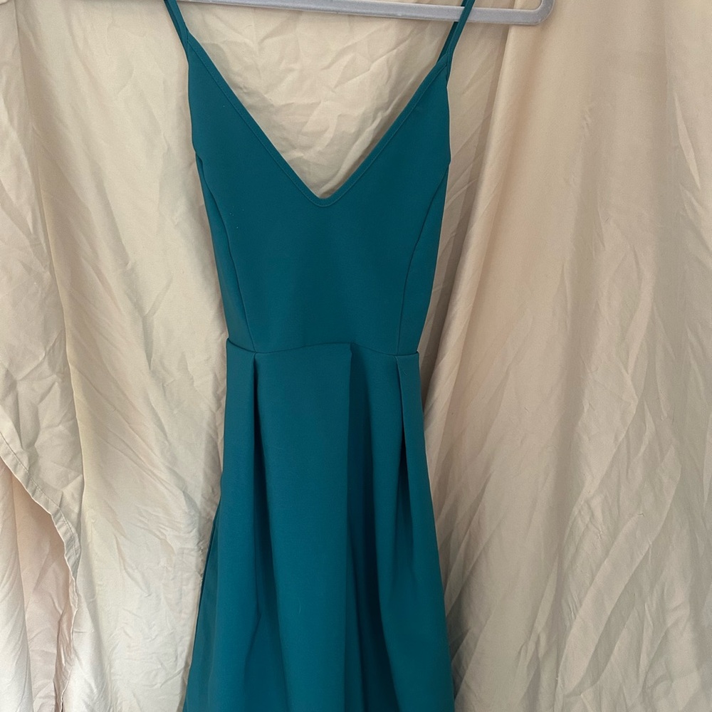 Elegant Teal Sleeveless Dress with Pockets